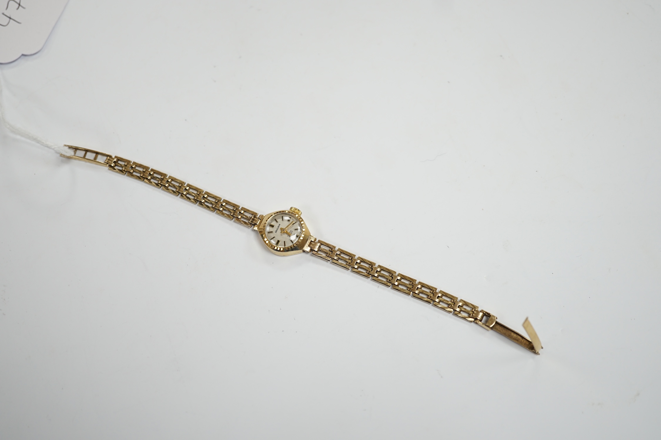 A lady's 9ct gold Excalibur manual wrist watch, on a 9ct gold bracelet, overall 17.5cm, gross weight 12 grams.
